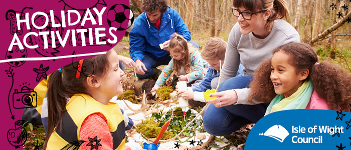 A picture showing children enjoying the Isle of Wight's Holiday Activities and Food programme in some woodland
